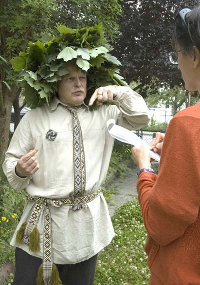 Jonas Stundzia being interviewed by Lesley Ham; Lithuanian summer solstice garlands; 2012: Lawrence, Massachusetts